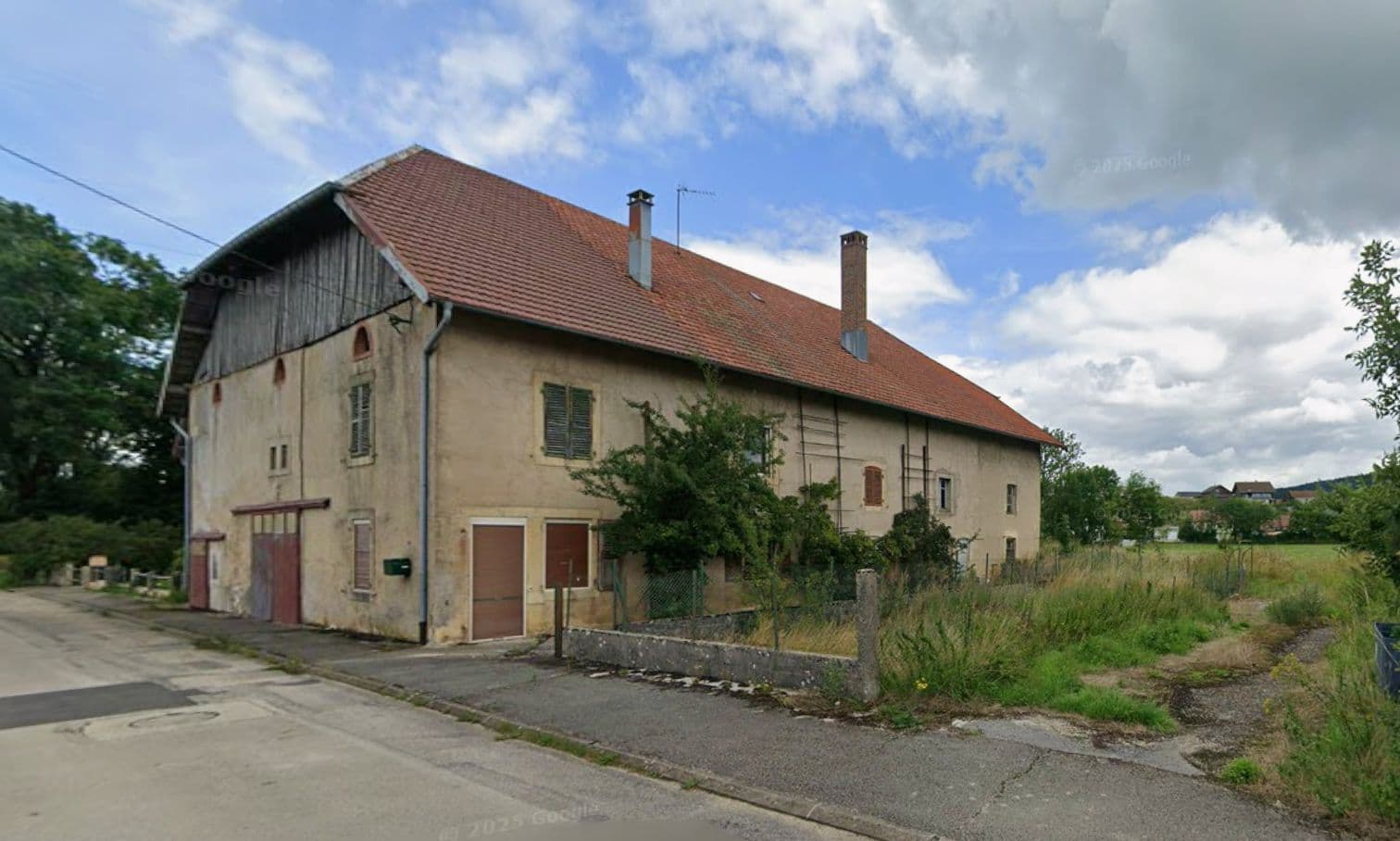 Réhabilitation d'une ferme et création de 24 logements dans le Doubs — vue 2